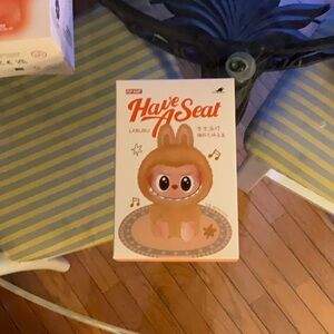 Have A Seat Tan Doll selled surprise